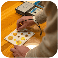 Appraiser validating vintage gold coins